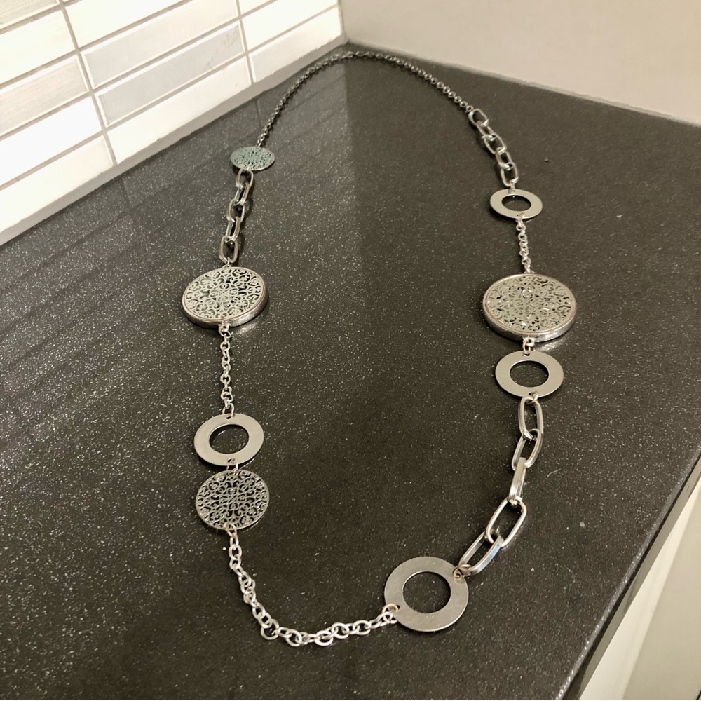 Women’s necklace with multiple embellishments